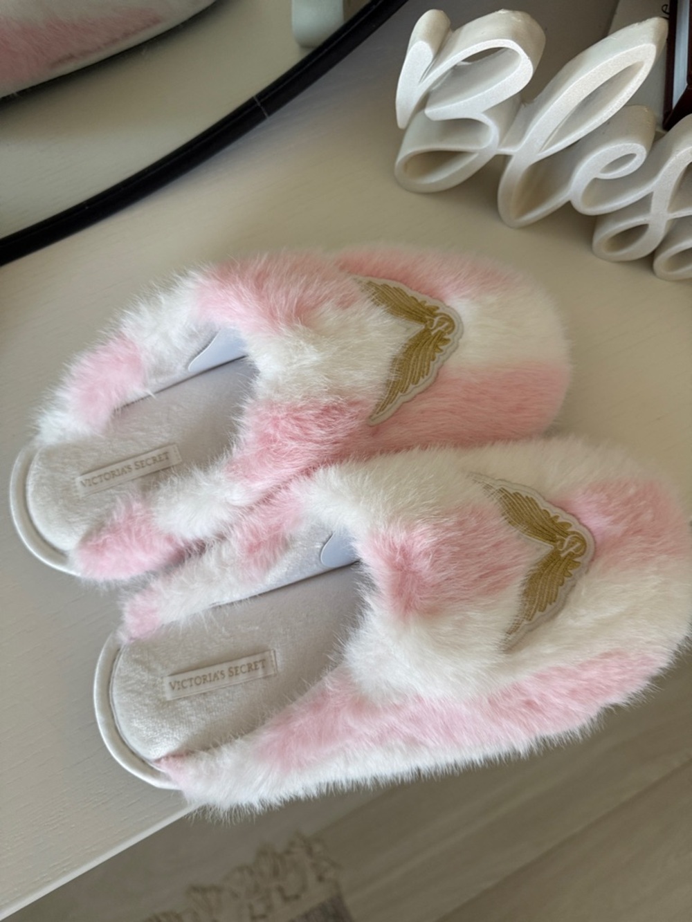 Victoria's Secret Pink and White Fuzzy Slippers with Gold Wing Patch - Picture 2 of 6